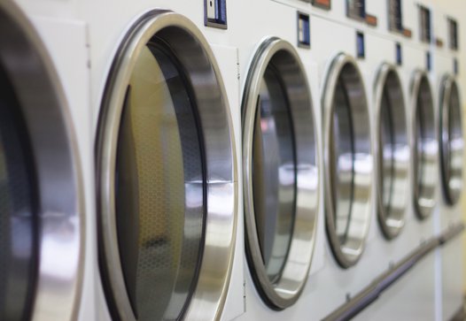laundromat machine washer line with closed doors (shallow depth of field)